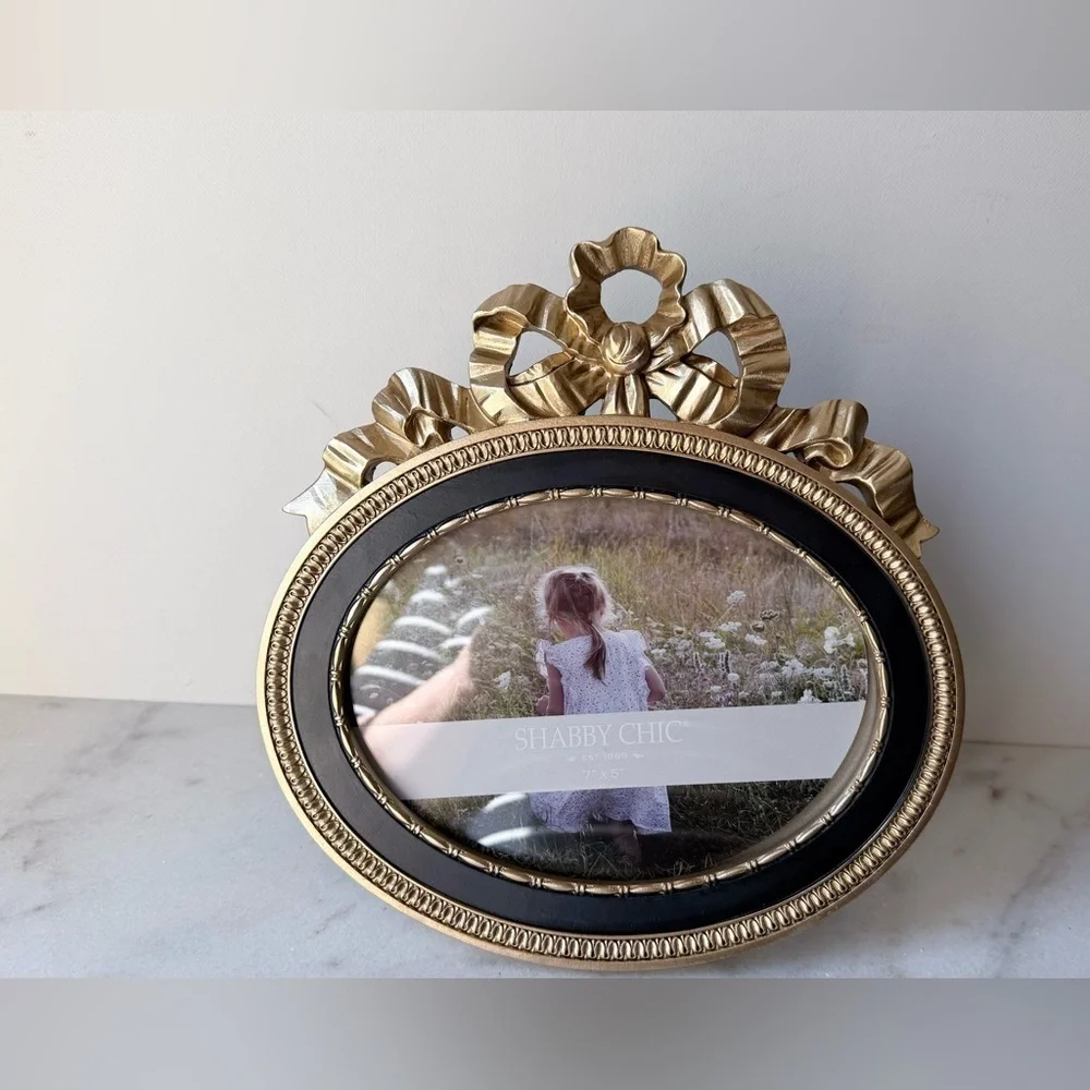 Ornate Oval Gold Photo Frame with Black Trim bow on top 7”x5”
